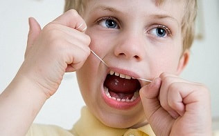 Flossing helps to clean between teeth