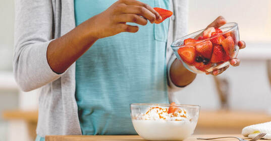 Rich strawberries and ripe blueberries are priority choice of toppings for yogurt